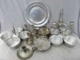 Two hammered aluminum divided dishes made in Italy, wall sconces, candle holders, more. Some may be