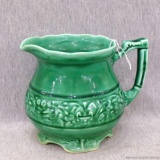 Unique green pitcher stands about 5