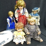 Pretty porcelain dolls and vintage plastic dolls. All in well kept condition. Would add to your