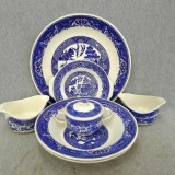 Complimentary blue and white pieces incl platter, bowls, more. Platter and two larger bowls are