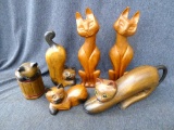Interesting wooden cat statues, measure 10 1/2'' tall. All in good shape, Solid wood pieces, perfect
