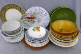 Glass bowls and platters, all dishes look to be in good condition, with some minor chips and wear.