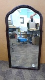 Charming wooden framed mirror, measures 38'' x 20 1/2''. Would look nice hung up in your home.