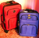 Located at alternate address in Prentice. Two travel suitcases, both in decent condition with some