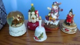 Located at alternate address in Prentice. Snow globe, three snowman music boxes, 1978 porcelain bell