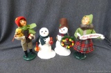 Two Byers' Choice The Carolers figures incl OH Boy with Bear and Packages and OH Girl with Banner;