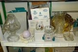 Located at alternate address in Prentice. PartyLite candle displays including stemmed pieces,