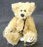 Miniature Boyd's Bear with key is part of The Mohair Bear Collection and is in good condition.