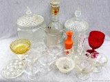 Variety of pretty glass dishes. Incl. candy containers, cups, small dishes, flower frog, and more.