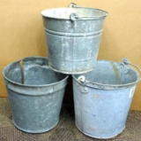 Three vintage metal pales, all about 10 1/2'' tall. In good condition, with some surface rusting in