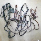 Leather horse bridles and halters. All in decent condition. Mainly measure 21'' long. Leather looks