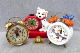 Mickey Mouse and Minnie Mouse alarm clocks, plus a smaller Mickey clock and a 101 Dalmatians clock.