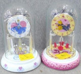 Pair of Disney anniversary clocks are Cinderella and Winnie the Pooh themed. Seller notes both work,