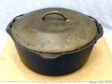 Cast iron Dutch oven in good shape. Bottom is unmarked, bottom of lid is marked 10-1/2, 8. Nice