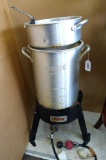 Bayou Classic 30 quart turkey fryer with fish basket and pan. Unit stands 29