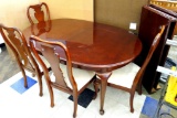 Thomasville Furniture Queen Anne style dining table with four chairs and two leaves. Matches china