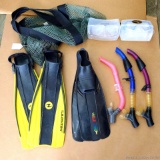 Two sets of snorkeling gear. One set (ladies?) Sprint flippers size 6-7, Aqua Lung mask and Aqua