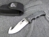 Gerber hunting knife with gut hook was made in USA and comes with belt pouch. Measures about 8-1/2