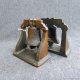 Pair of heavy cast bell bookends are about 4-1/2