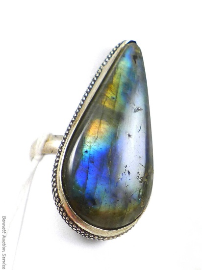 Sterling silver ring marked 925 size 7 with teardrop shaped stone with stunning rainbow colors when