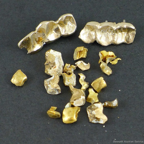 12.6 grams of dental gold. 14K test acid did not dissolve sample, 18K test acid partially dissol...