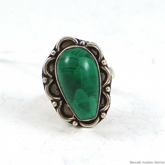 Pretty ring size 7 with tear drop shaped green stone.