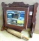 Antique beveled glass mirror is built into a wall storage box/ towel bar bracket, measures approx.