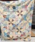 Pretty vintage quilt is in overall good condition and measures approx. 5-1/2' x 80