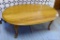 Attractive coffee table is in good condition and measures about 45