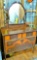 Vintage dresser with mirror has dovetailed drawers. Dresser measures about 40