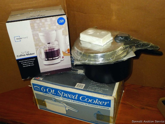 New in box 6 quart Mirro speed cooker and a new in box 12 cup coffee maker.