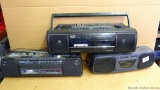 Hitachi, GE, and Magnavox boom boxes with radio and cassette players. Largest is 20