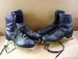 Two pair of men's figure skates - great for winter decoration.