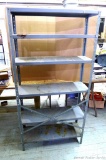 Steel shelving unit with adjustable shelves is approx. 4' wide and 6-1/2' tall. Sturdy and in good