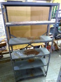 Steel shelving unit with adjustable shelves is 4'' wide and approx. 6' tall. Sturdy and in good