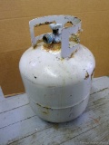 20 lb. propane tank feels like it has some propane, but with some corrosion at top.