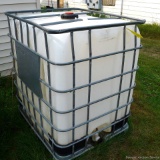 Caged IBC (intermediate bulk container) poly tote is approx. 40 x 45 x 52 high.