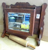Antique beveled glass mirror is built into a wall storage box/ towel bar bracket, measures approx.
