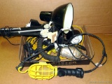 A bright lot, with work lights, an extendable lamp, and other lamps. All in good condition. Work