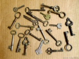 Skeleton and other antique keys including barrel, cast iron, brass, flat, and others.