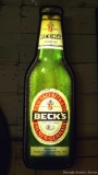 Unique Beck's German Beer light up sign, in working condition. Neat sign measures 26'' x 8''