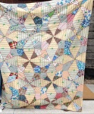 Pretty vintage quilt is in overall good condition and measures approx. 5-1/2' x 80