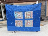 Nice tied quilt with vintage fabric accents measures approx. 5' x 7' and is in overall good