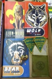 Cub Scout books from 1948, 1948, and 1954, Boy Scout signal mirror, and kerchief slide, and camp