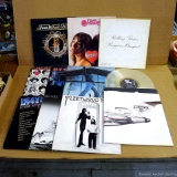 Vintage record albums including Rolling Stones, Heart, Beastie Boys, REO Speed Wagon, Billy Joel,