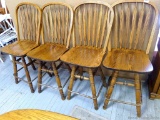 Four swiveling bar stools are about 17