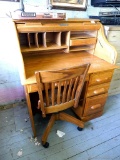 Lockable rolltop desk with keys and rolling wooden office chair. Desk measures 38