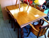 Nice smaller sized solid wood kitchen table set comes with six chairs. Table measures 5' x 3-1/2'.