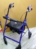 Drive foldable wheelchair is nice. Brakes work. Has storage underneath. Measures about 21