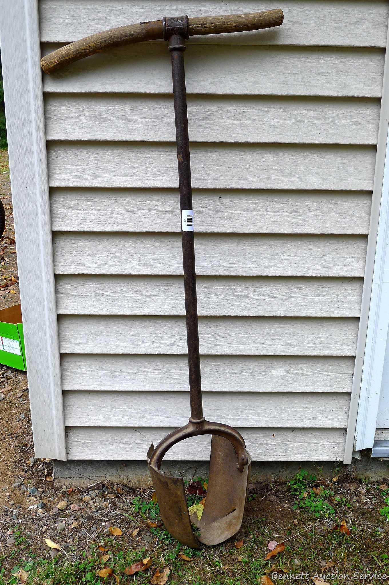 Antique post hole digger is about 46